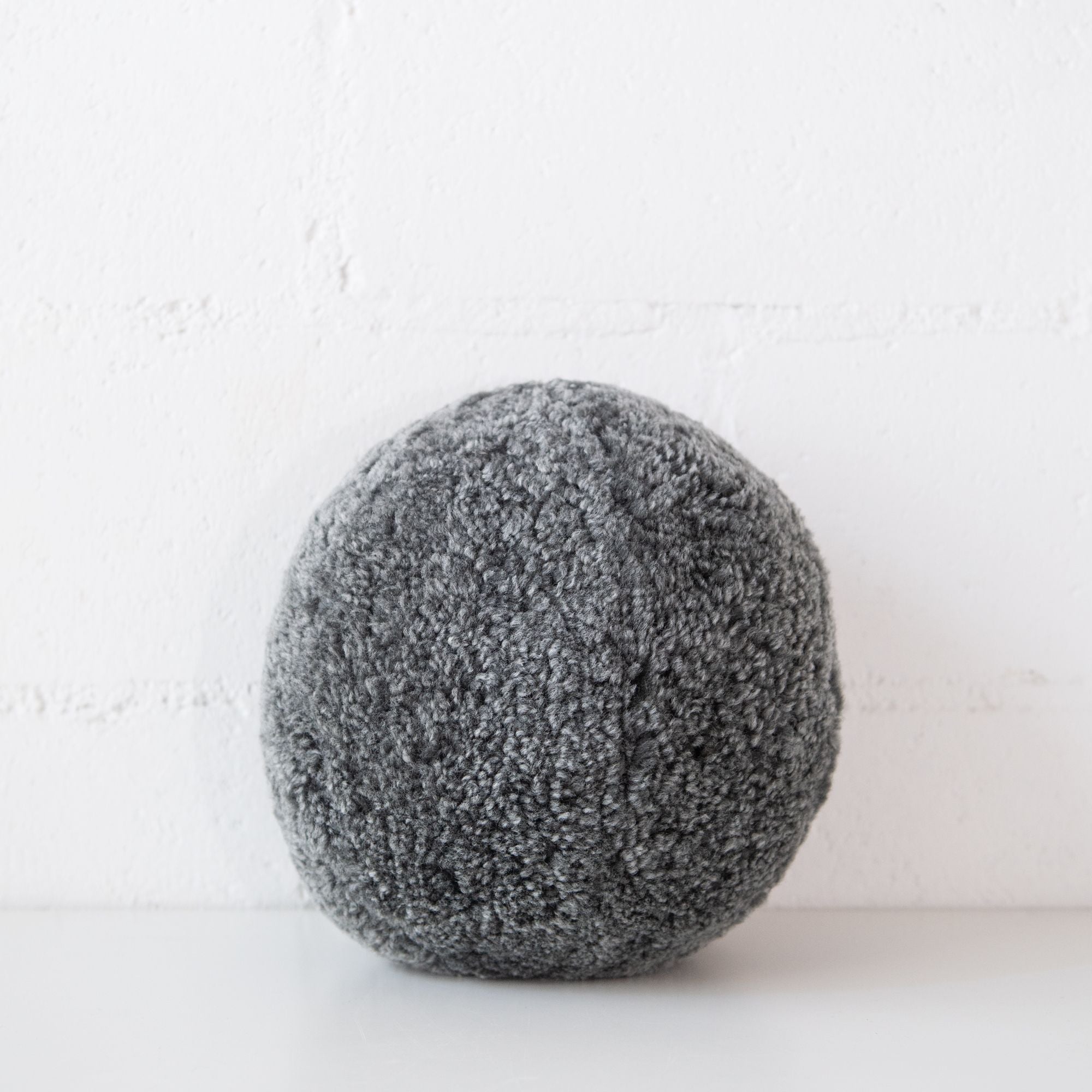 Angelite Round Curly Sheepskin Cushion in Graphite, from Natures Collection